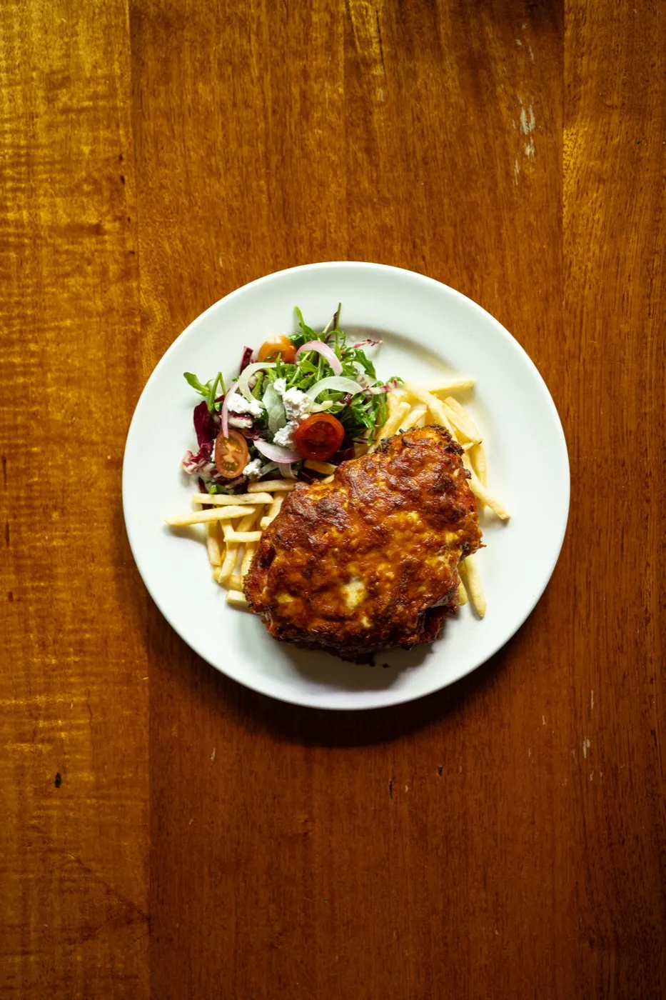 Chicken parma with chips and salad